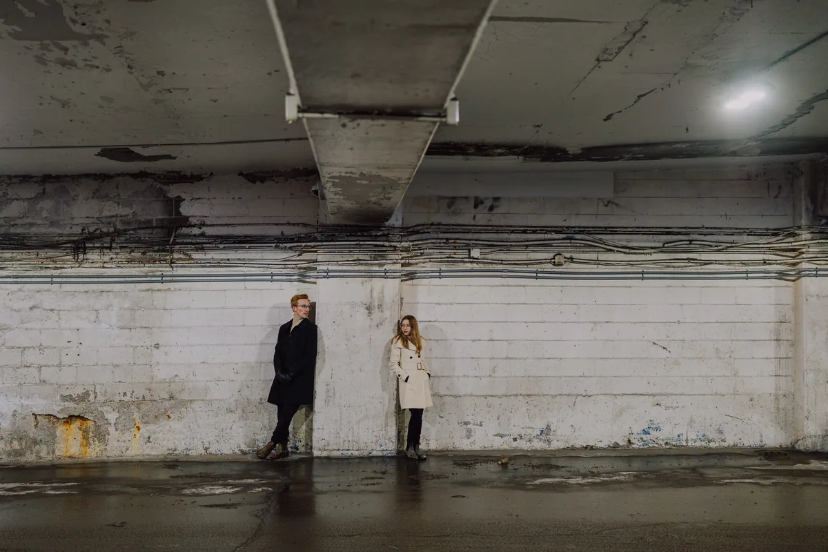Kaitlyn and Alex during their engagement shoot on the frozen canal