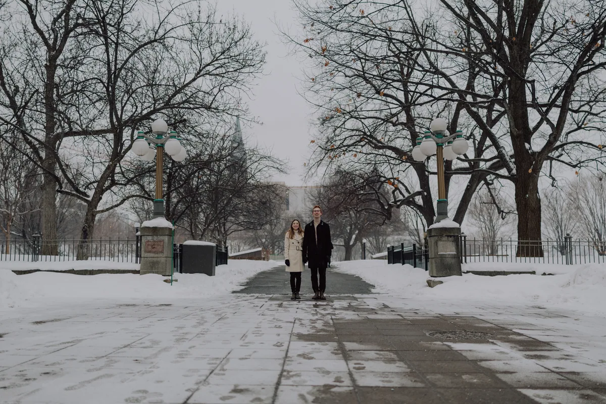 Kaitlyn and Alex during their engagement shoot on the frozen canal