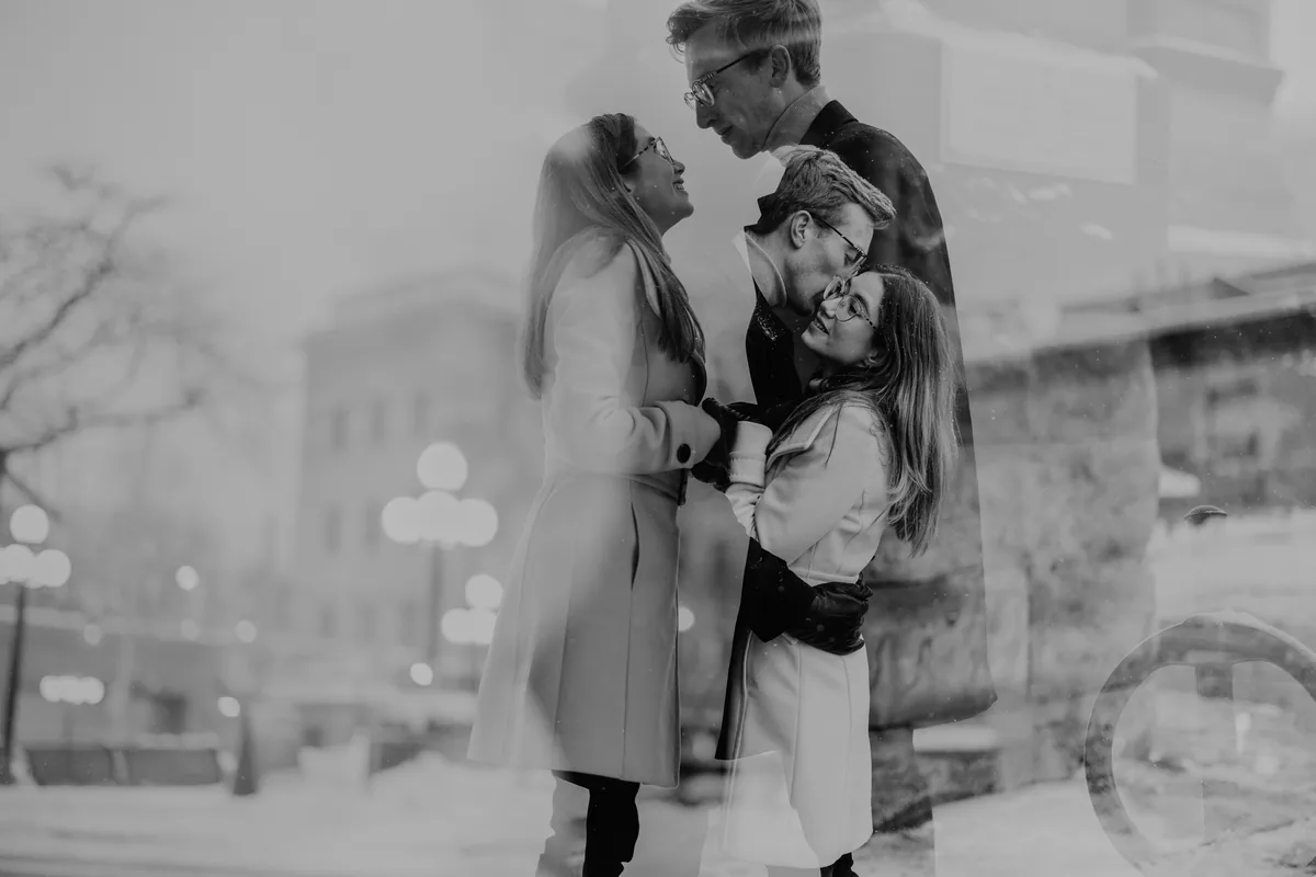 Kaitlyn and Alex during their engagement shoot on the frozen canal