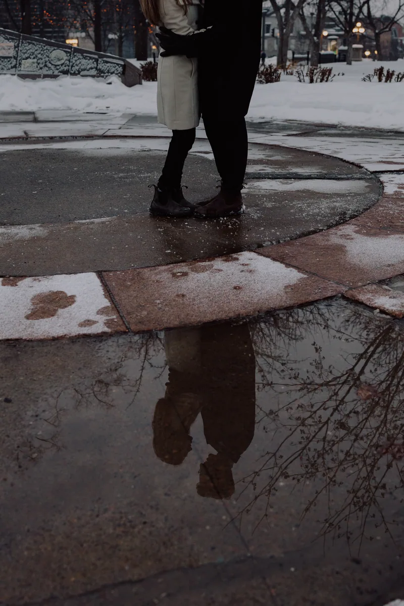 Kaitlyn and Alex during their engagement shoot on the frozen canal