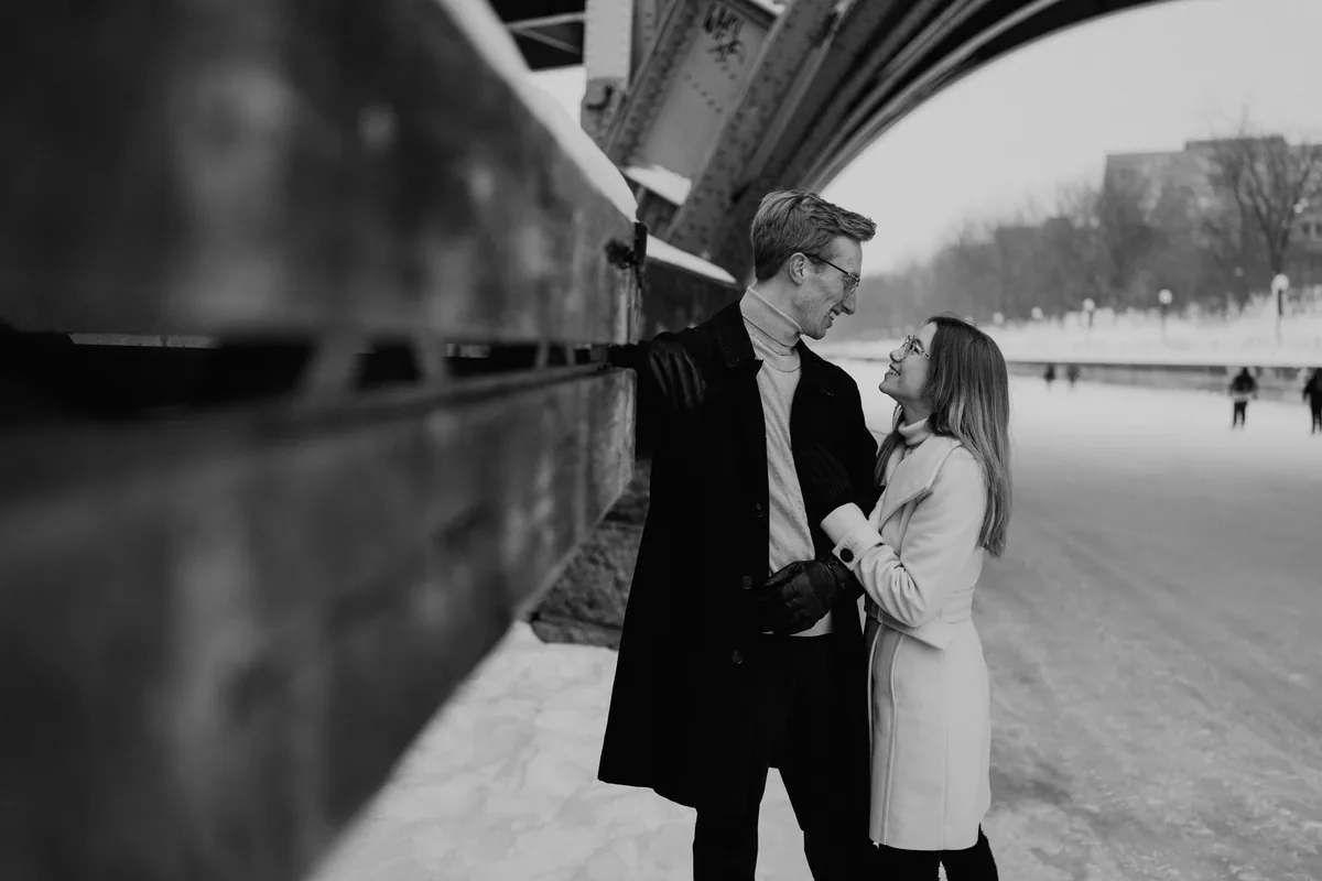 Kaitlyn and Alex during their engagement shoot on the frozen canal