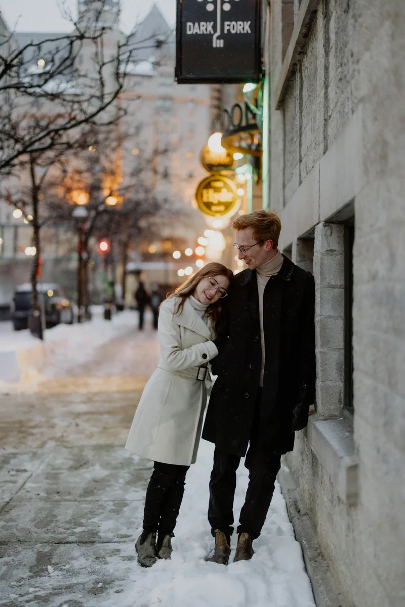 Kaitlyn and Alex during their engagement shoot on the frozen canal