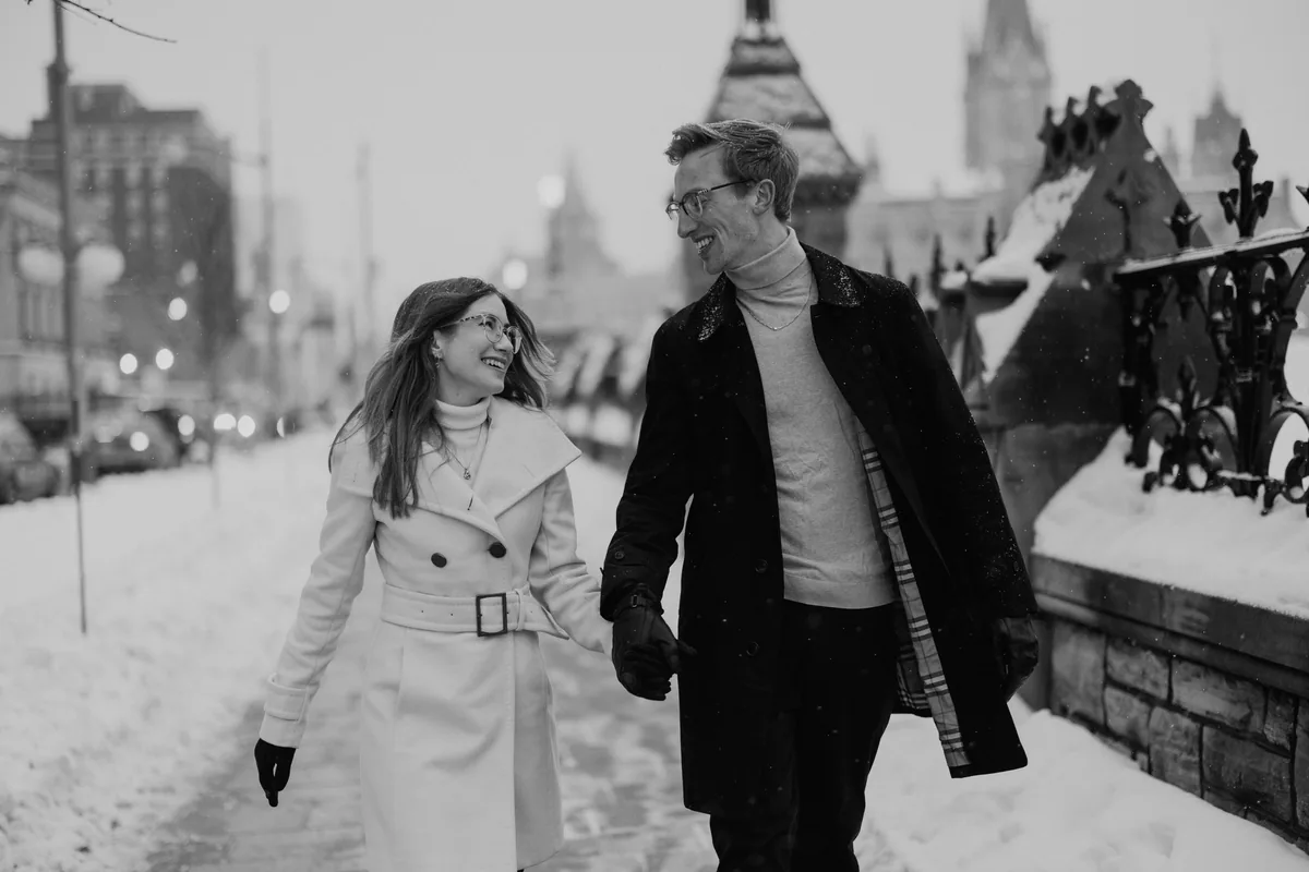 Kaitlyn and Alex during their engagement shoot on the frozen canal